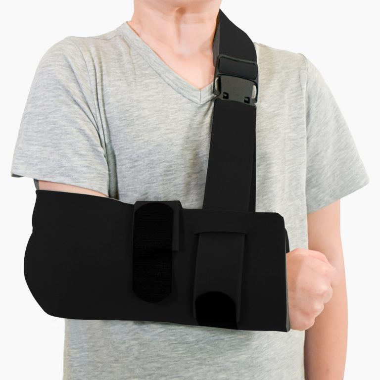 A child wearing the black Beagle Orthopaedic Paediatric High Arm Sling, which provides comfortable, breathable support and secure immobilisation for smaller frames.
