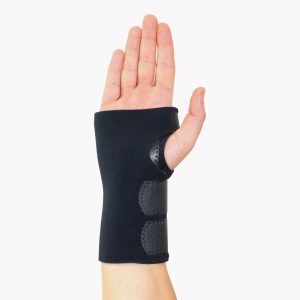 TheraCore | TheraCore,Sustainable orthopaedic materials,NHS net zero supplier,PFAS-free orthopaedic materials,Low-carbon medical manufacturing TheraCore Universal Standard Wrist Brace shown on a hand with palm facing forward, displaying the adjustable hook straps and secure fit.