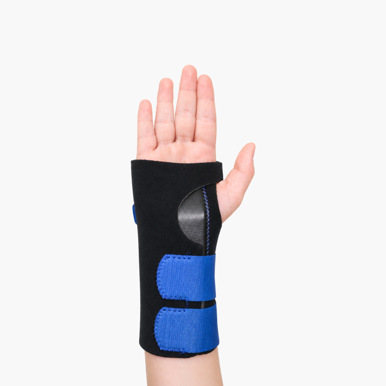 Paediatric extended universal wrist brace with blue fastening straps shown on a child's arm.